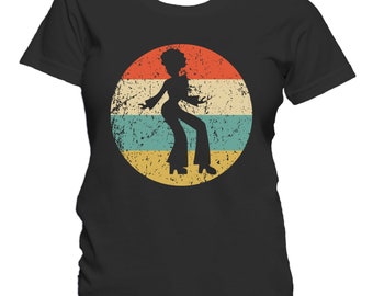 May include: A black t-shirt with a vintage-style graphic of a woman dancing in a retro silhouette. The graphic is set against a circular background with red, yellow, blue, and white stripes.