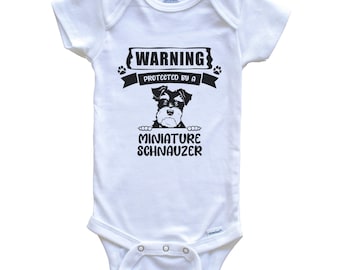 Warning Protected By A Miniature Schnauzer Funny Dog Breed Baby Bodysuit - Cute Miniature Schnauzer One Piece