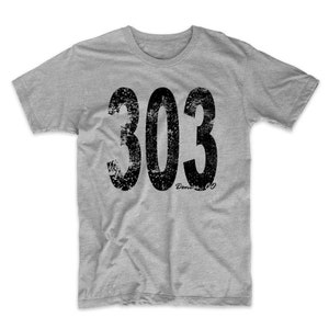 May include: A heather grey t-shirt with a distressed black graphic of the number 303. The text "Denver CO" is written in black below the number.