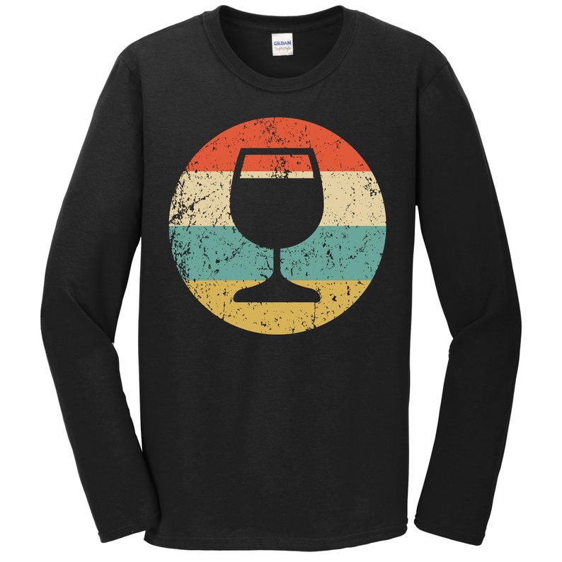 May include: Black long-sleeve t-shirt with a vintage-style graphic of a wine glass in a circle with red, yellow, blue, and green stripes.