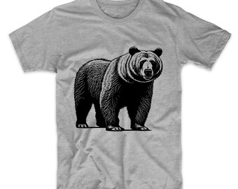 May include: A gray t-shirt with a black and white illustration of a bear.