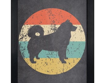 May include: A framed wall art print featuring a dark silhouette of a dog with a curled tail centered over a distressed circular background. The background consists of horizontal stripes in orange, cream, teal, and yellow, all enclosed in a black frame.