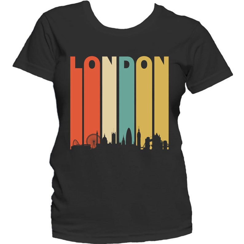 May include: A black t-shirt with a retro-style graphic of the London skyline and the word "LONDON" in a colorful striped design.