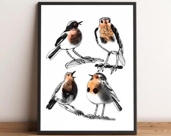 May include: A framed art print featuring four stylized illustrations of birds. The birds are depicted in black ink with watercolor accents of orange and brown. The artwork is set against a white background, framed in a black border, and rests on a wooden surface.