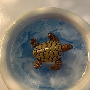 White ceramic trinket tray with sea turtle.