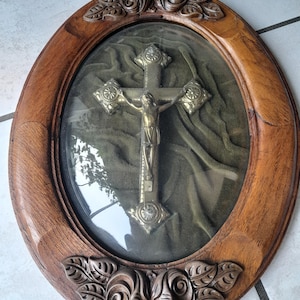 Vintage French Jesus on crucifix cross set in oval glass wooden frame