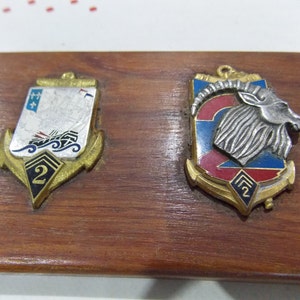 2 x French military badges medals mounted on Oak board