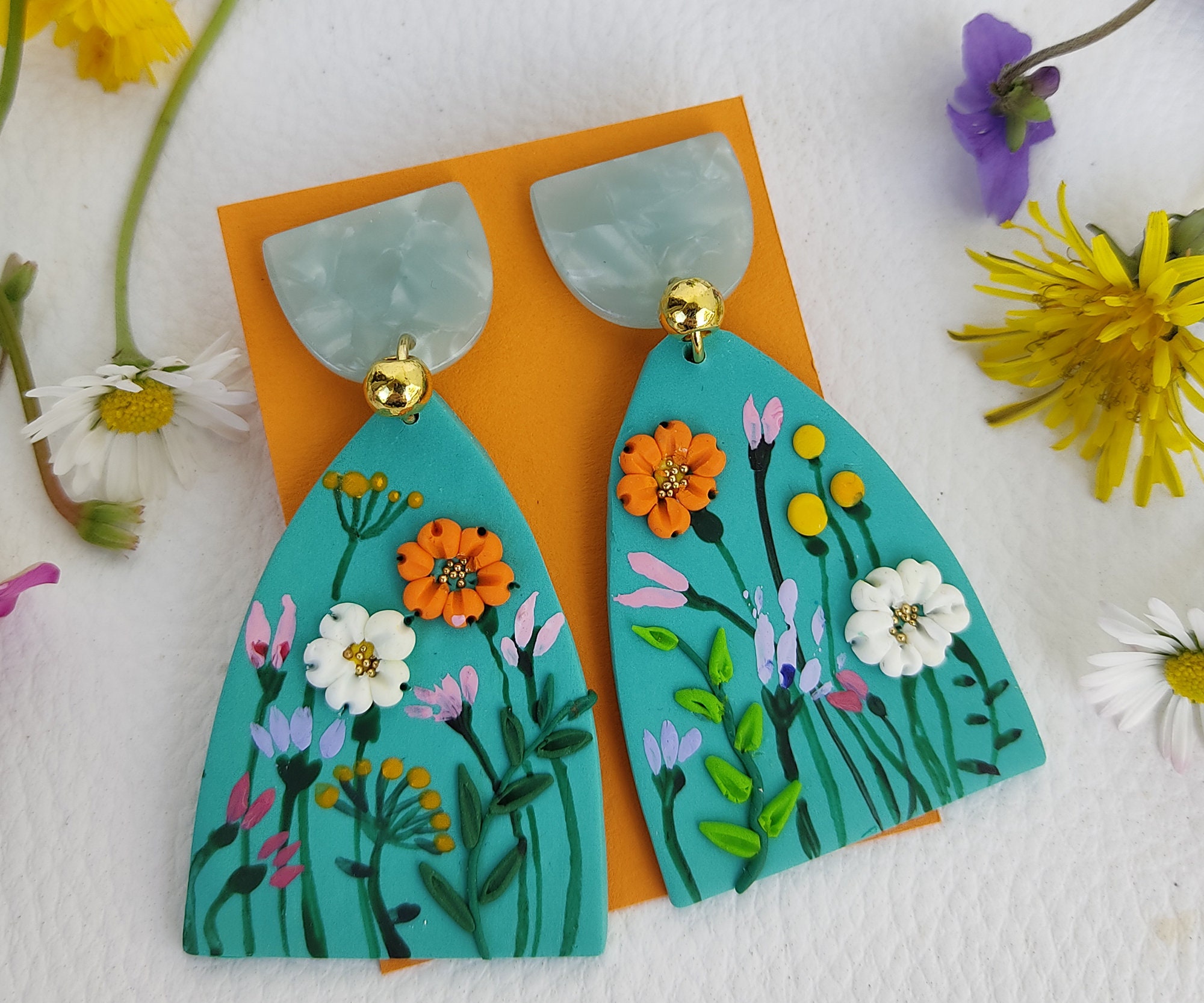 creative art polymer clay earrings. Flower design in original statement