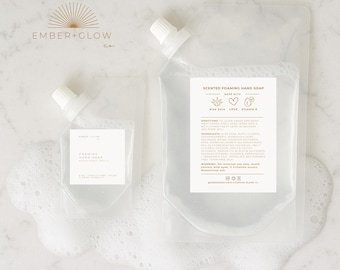 May include: Two clear plastic pouches of scented foaming hand soap with white spouts. The larger pouch has a label with product information and the words "Scented Foaming Hand Soap". The smaller pouch has a label with the words "Foaming Hand Soap".