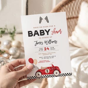 May include: Baby shower invitation with a race car theme. The invitation features the text "Race on over for a Baby Shower" and includes the name "James Williams". A red race car illustration with balloons is at the bottom.