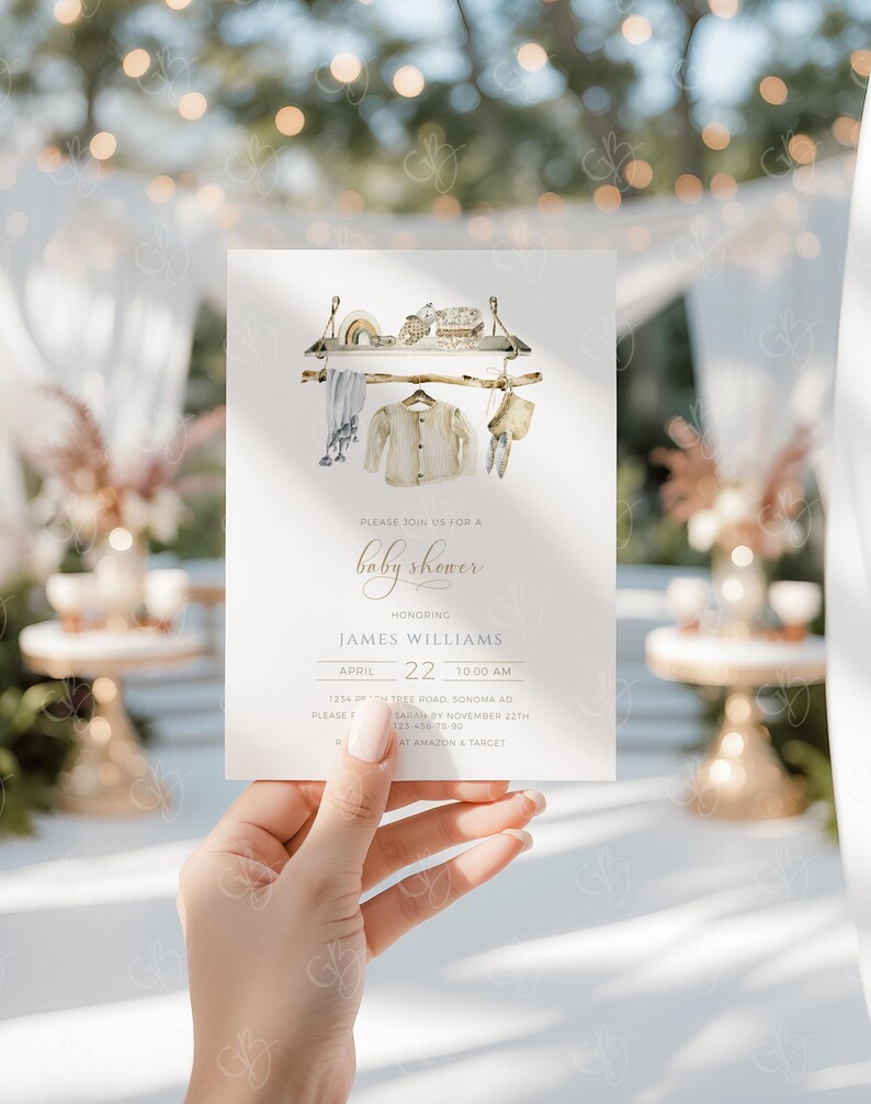 May include: A baby shower invitation with a watercolor illustration of a clothesline with baby clothes hanging on it. The invitation is for James Williams on April 22nd at 10:00 AM. The address is 1234 Tree Road, Sonoma, CA. RSVP by November 22nd.  Please call 323-456-7300.  Gifts can be purchased at Amazon and Target.