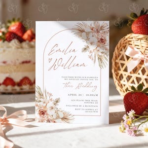May include: A wedding invitation with the names "Emilia & William" in elegant script, framed by a copper arch and floral arrangements. The invitation includes the wedding date, time, and location, with a soft, romantic aesthetic.