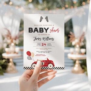 May include: A baby shower invitation with a red race car and checkered flag design. The invitation reads "Race on over for a Baby Shower in honor of James Williams, Sat Apr 24 2 PM, 1234 Peach Tree Road, Sonoma, AD. RSVP: Jessica by Apr 15 at 123-456-76-90. Registered at Amazon & Target."