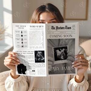 May include: A person holding a newspaper announcing "The Newborn Times" with the headline "Coming Soon." The newspaper includes a baby shower timeline, word search, and sonogram images. The newspaper is in black and white.