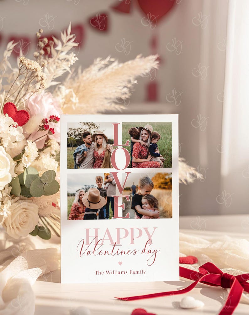 May include: A Valentine's Day card with the word "LOVE" in large pink letters and family photos. The card reads "HAPPY Valentine's day" and "The Williams Family" in a script font. A red ribbon and floral arrangement are in the background.
