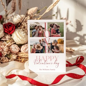 May include: A Valentine's Day card with family photos and the word "LOVE" in pink. The card reads "Happy Valentine's Day" and "The Williams Family" in a cursive font. A red ribbon and flowers are in the background.