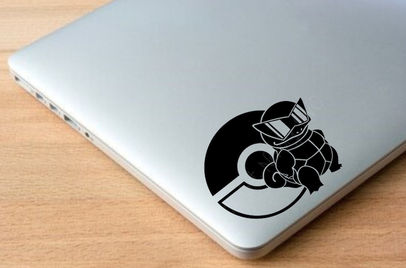 May include: Black and white sticker of a cartoon turtle wearing sunglasses and sitting on a Pokeball.