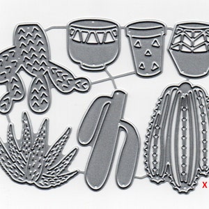 May include: A die-cut metal template featuring various desert plant designs, including cacti and succulents, along with several decorative pots. The template is in a silver color and is designed for crafting projects.