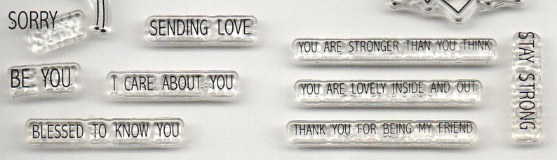 May include: Clear stamps with various positive messages, including "Stay Strong", "Be You", "Sending Love", "I Care About You", "Blessed to Know You", "You Are Stronger Than You Think", "You Are Lovely Inside and Out", and "Thank You For Being My Friend".