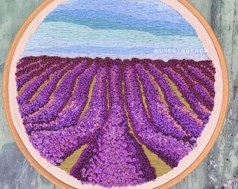 Hand embroidered Lavender field thread painting, purple french knot flower field with blue and silver sky.
