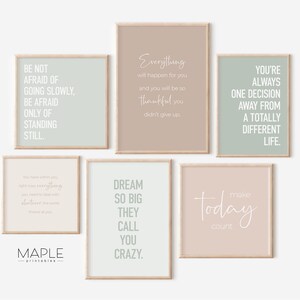 May include: Set of six printable wall art prints with inspirational quotes in a minimalist style. The prints feature a light green, light brown, and light pink background with white text. The quotes are: "Be not afraid of going slowly, be afraid only of standing still.", "Everything will happen for you and you will be so thankful you didn't give up.", "You're always one decision away from a totally different life.", "You have within you right now everything you need to do what you want to do with whatever the world throws at you.", "Dream so big they call you crazy.", and "Make today count."