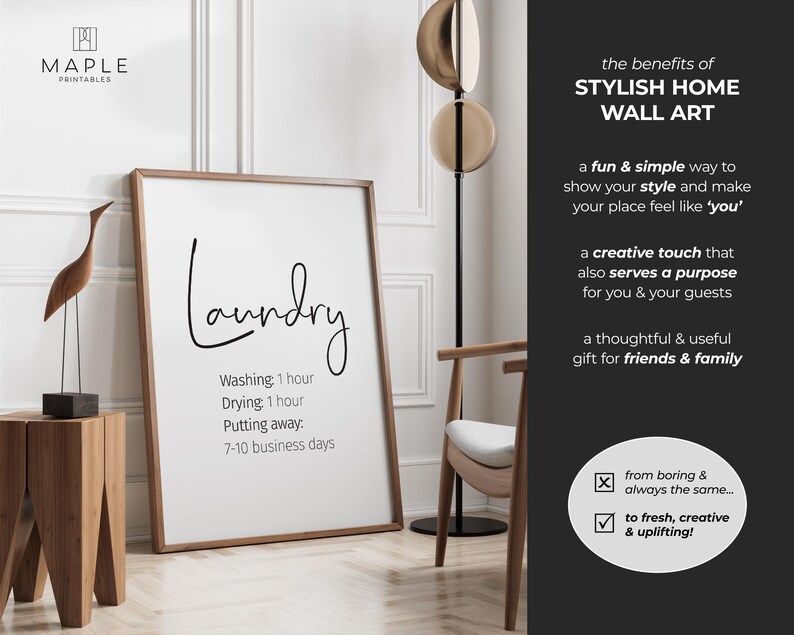 May include: A framed white print with the word "Laundry" in a stylish script. Below, it lists washing and drying times, and the time to put away. The print is in a room with a wooden side table, a decorative bird sculpture, and a modern floor lamp.