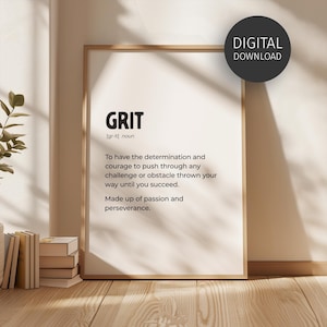 May include: A framed print with the word "GRIT" in bold letters, along with its pronunciation and definition. The definition emphasizes determination and perseverance. A digital download label is in the upper right corner. The frame is a light brown color.