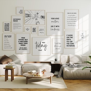May include: A collection of framed motivational posters with black text on a white background, displayed on a white wall. The posters feature various quotes and phrases, including "Make Today Count" and "Your Voice Matters." The room is furnished with neutral-toned sofas and wooden furniture.