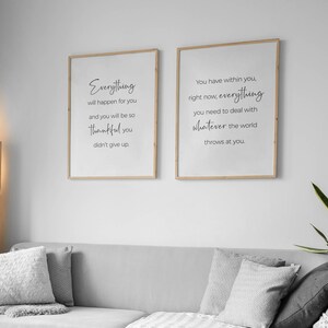 May include: Two framed prints with inspirational quotes. The left print reads "Everything will happen for you and you will be so thankful you didn't give up." The right print reads "You have within you, right now, everything you need to deal with whatever the world throws at you."