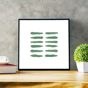 May include: A framed print with a minimalist design featuring a series of green brushstrokes on a white background.