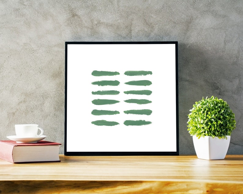 May include: A framed print with a minimalist design featuring a series of green brushstrokes on a white background.