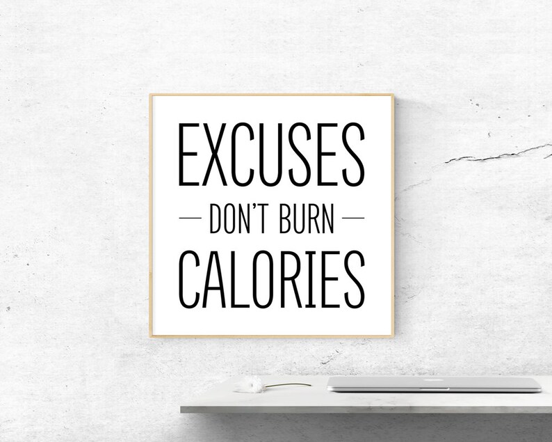 May include: A motivational quote in a black frame on a white wall. The quote reads "Excuses - Don't Burn - Calories".