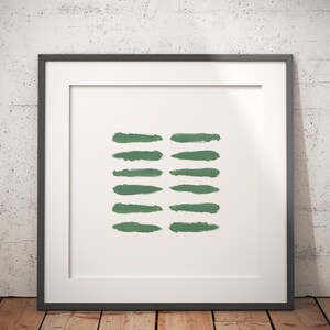 May include: A framed print with a minimalist design featuring a series of horizontal green brushstrokes on a white background.