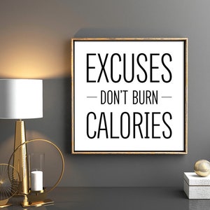 May include: A motivational quote print with a gold frame. The quote reads "Excuses - Don't Burn - Calories".