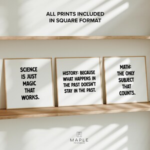 May include: Three framed prints with educational quotes: "Science is just magic that works," "History: Because what happens in the past doesn't stay in the past," and "Math: The only subject that counts." The prints are displayed on a wooden shelf.