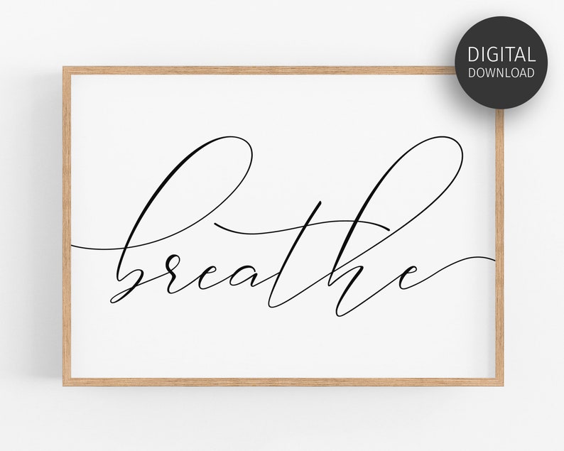 May include: A printable wall art design featuring the word "breathe" in a modern calligraphy style. The word is written in black ink on a white background.