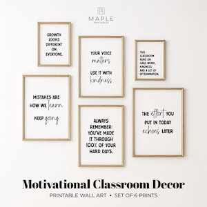 May include: Set of six framed prints with motivational quotes in black text on a white background. The frames are gold. The text includes phrases like "Growth looks different on everyone" and "Your voice matters."