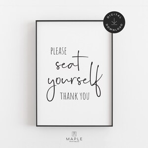 May include: A framed print with the words "PLEASE seat yourself THANK YOU" in black script on a white background. The print has a black frame and a digital download icon in the upper right corner.