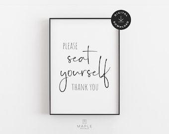 May include: A framed print with the words "PLEASE seat yourself THANK YOU" in black script on a white background. The print has a black frame and a digital download icon in the upper right corner.