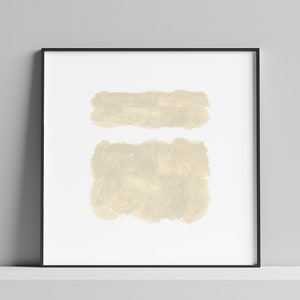 May include: A framed abstract art print with two beige brushstrokes on a white background.