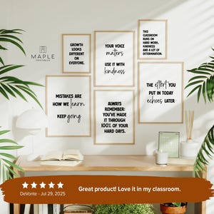 May include: A collection of framed motivational posters with black text on a white background. The posters are in wooden frames and feature inspirational quotes like "Growth looks different on everyone" and "Your voice matters."