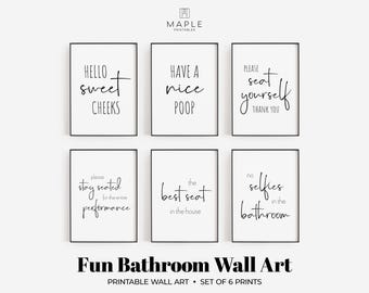 May include: Six framed bathroom wall art prints with black frames and white backgrounds. Each print has a different humorous phrase in black script. The phrases include "Hello sweet cheeks" and "No selfies in the bathroom."