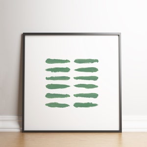 May include: A framed print with a minimalist design featuring a series of horizontal green brushstrokes on a white background.