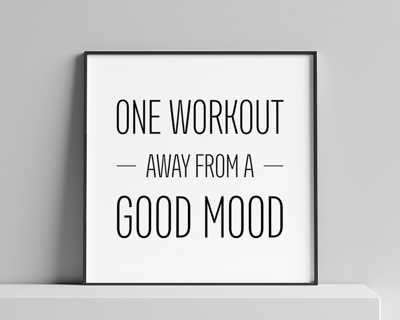 May include: Black and white motivational quote poster with the text "ONE WORKOUT AWAY FROM A GOOD MOOD" in a black frame.