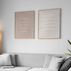 May include: Two framed prints with inspirational quotes. The left print has a light brown background with the text "Everything will happen for you and you will be so thankful you didn't give up." The right print has a white background with the text "You have within you, right now, everything you need to deal with whatever the world throws at you."