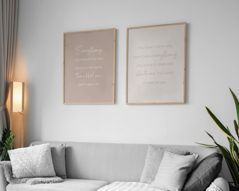 May include: Two framed prints with inspirational quotes. The left print has a light brown background with the text "Everything will happen for you and you will be so thankful you didn't give up." The right print has a white background with the text "You have within you, right now, everything you need to deal with whatever the world throws at you."