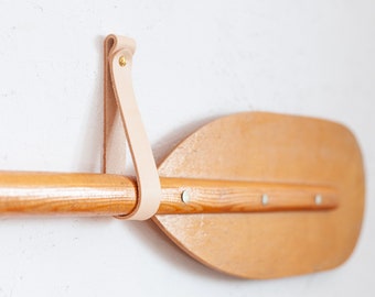 Decorative paddle hangers, decorative oar hangers, paddle wall mount, leather oar hanger, how to hang a decorative paddle, canoe paddle