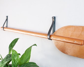 Decorative oars wall hanging, oar decor wall hanging, oar wall mount, leather oar hanger, how to hang a decorative oar, oar holder for wall