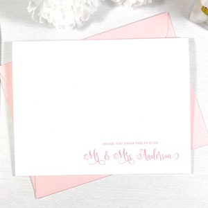 May include: A white card with pink ink that says "Thank you from the future Mr & Mrs Anderson". The card is sitting on a pink envelope.