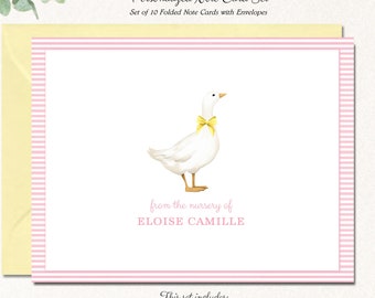 May include: A set of 10 folded note cards with envelopes featuring a watercolor illustration of a white duck with a yellow bow. The cards are pink and white striped with the text "from the nursery of ELOISE CAMILLE". The cards are 4.25 inches by 5.5 inches.
